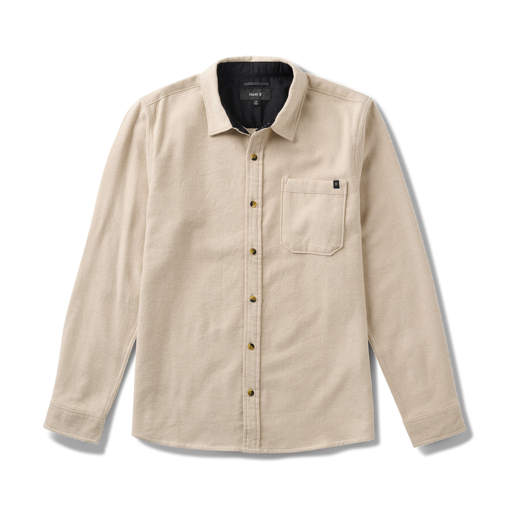 Close-up of a durable button on Roark gear, designed for adventure and outdoor activities. Big Image - 1