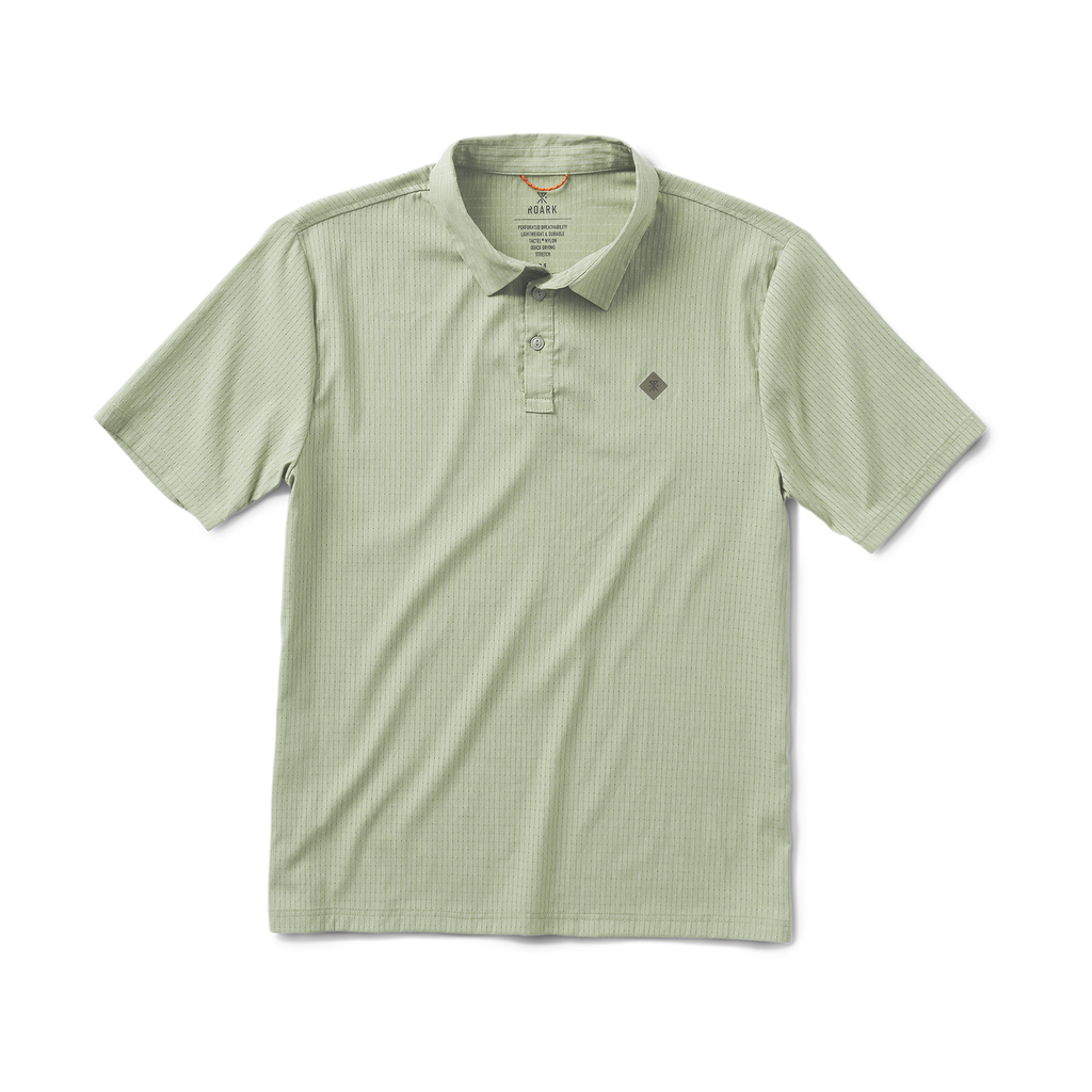 A man wearing a dusty green Roark Bless Up Breathable Stretch Polo Shirt, smiling at the camera. Big Image - 1