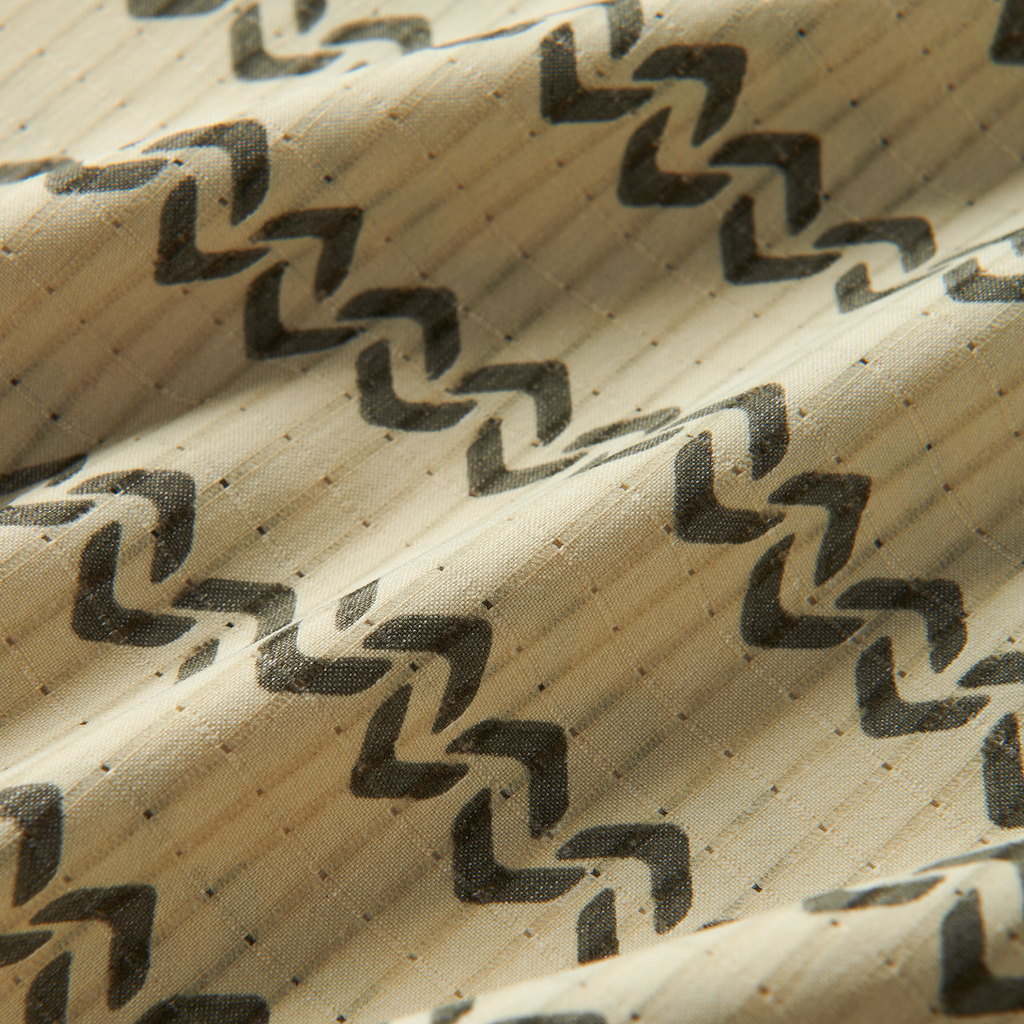 Close-up of rugged brown woven fabric with a distinctive pattern, embodying Roark’s adventure-ready textiles. Big Image - 12