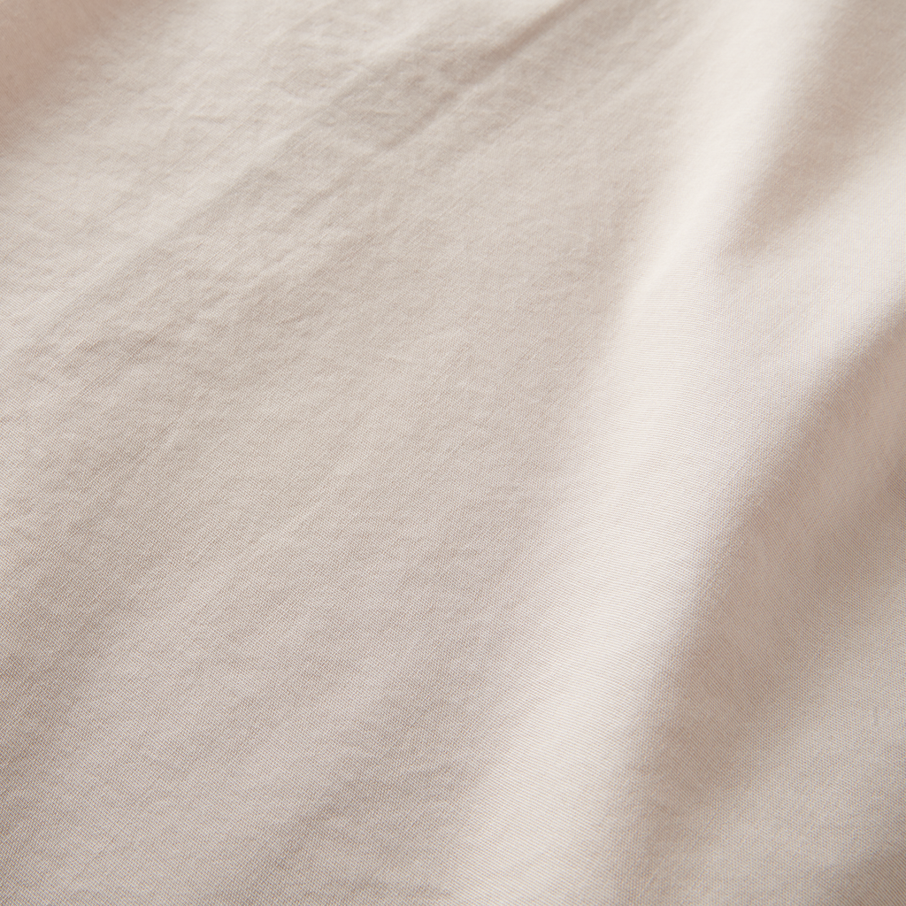 Detailed texture of the Roark Made To Fade Short Sleeve Button Up Shirt in Washed Bone, highlighting its breathable and soft fabric. Big Image - 8