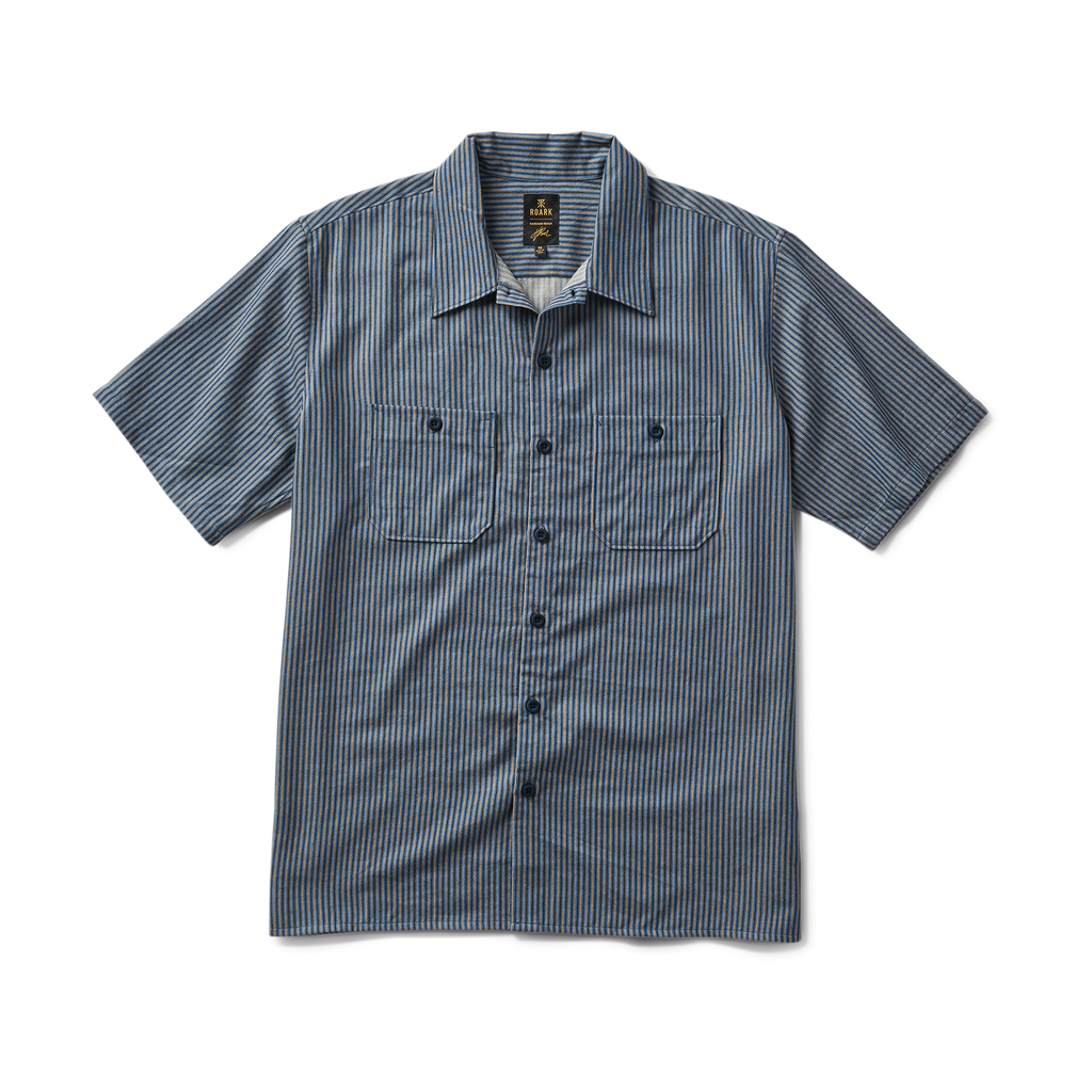 Close-up view of an active shirt by Roark, featuring detailed collar, sleeve, and button design, perfect for adventure and travel. Big Image - 1