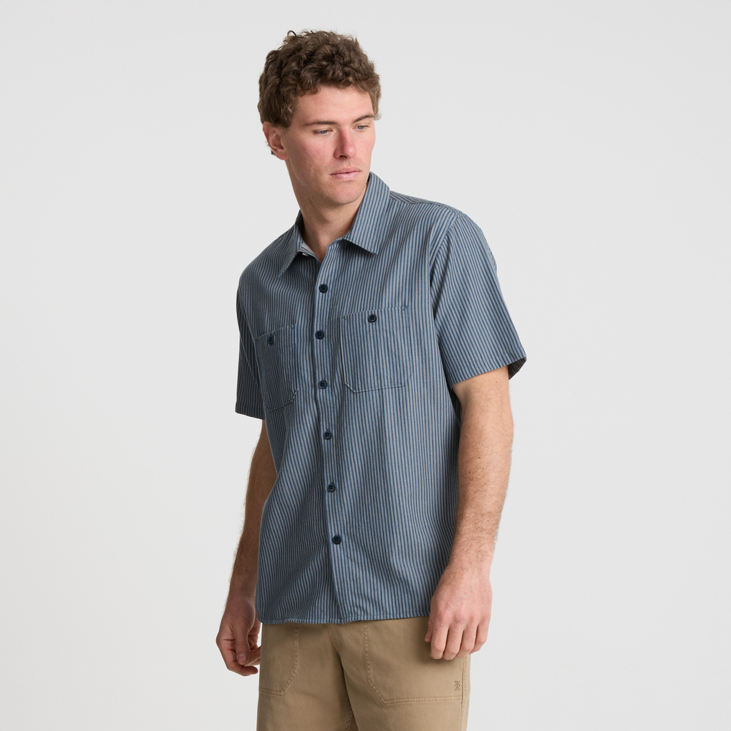 Stylish adventurer wearing a classic fedora and dress shirt with detailed collar and buttons, ready for a journey Big Image - 6