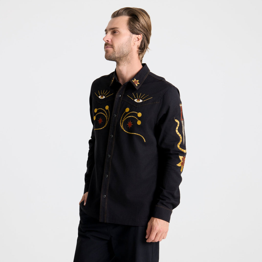 Detail of a rugged black denim shirt featuring durable buttons and a structured collar, perfect for outdoor adventures and travel. Big Image - 5