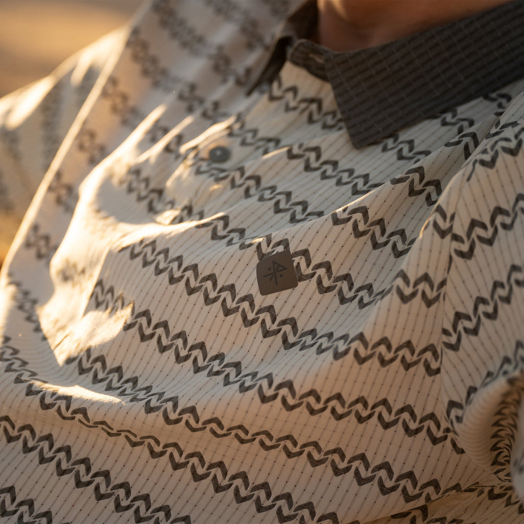 life-style-image Close-up of a Roark Baja-style shirt featuring a detailed pattern with a traditional collar and button design, perfect for outdoor and travel adventures. Big Image - 4