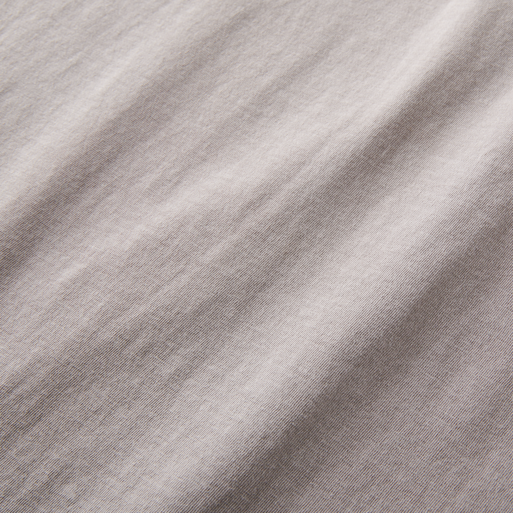 Detailed view of soft, textured cotton fabric in a light grey t-shirt. Ideal for a stylish yet comfortable outfit. Big Image - 14