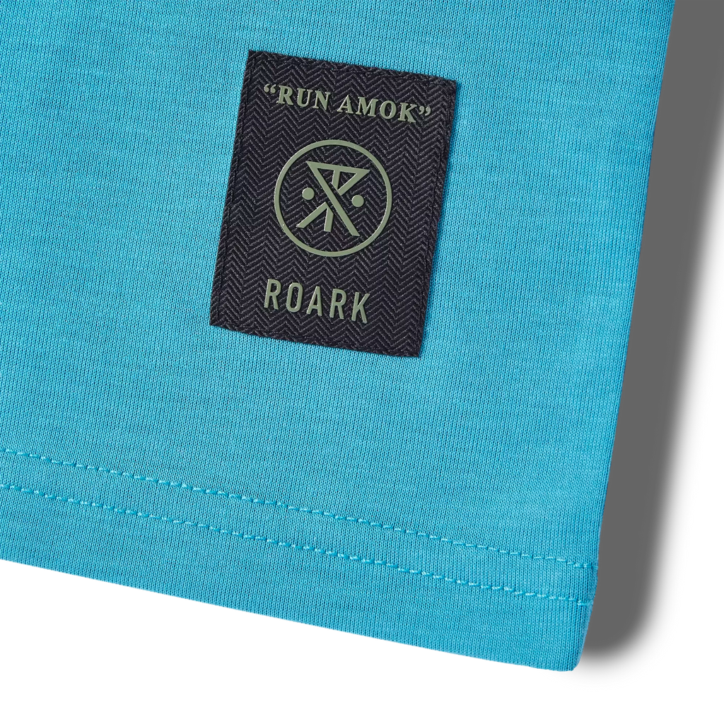 The front logos of Roark's Mathis Short Sleeve Knit - Tuned Out Turquoise Big Image - 8