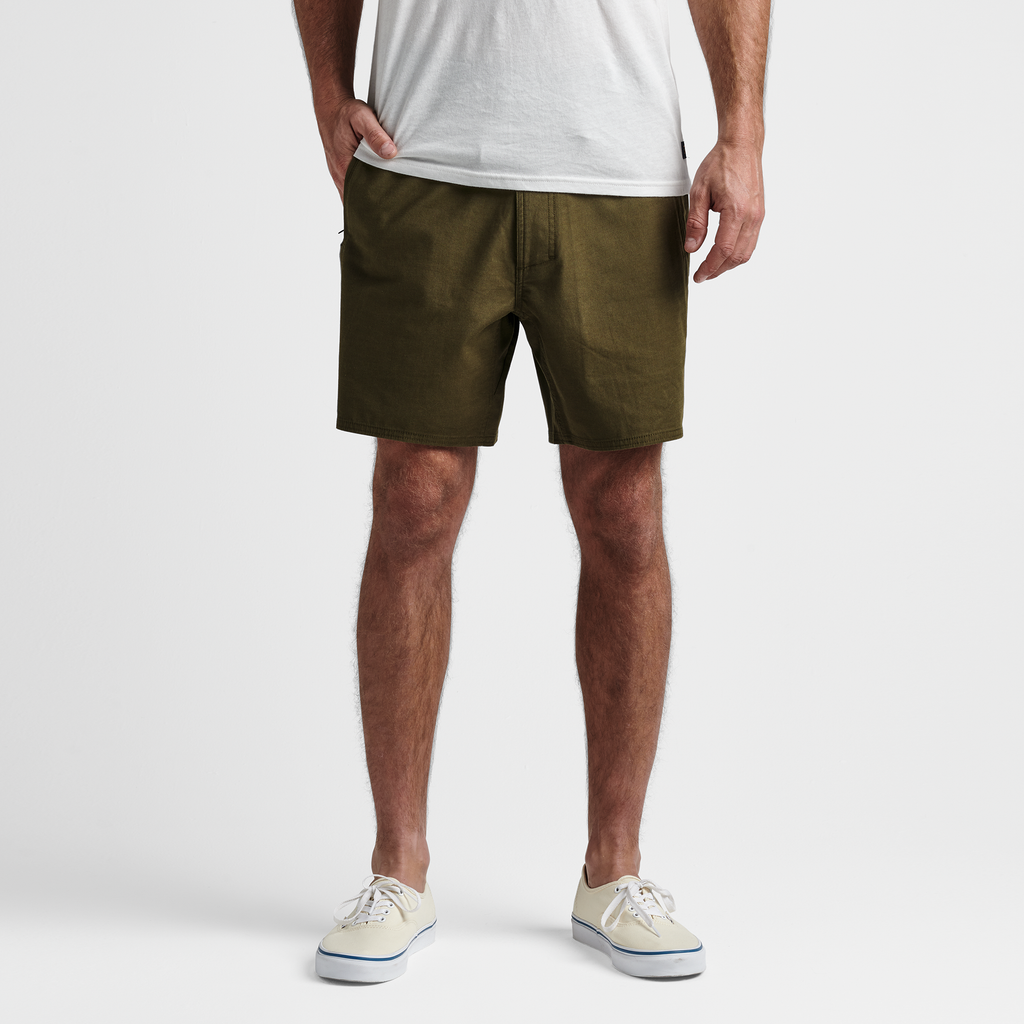 The model of Roark men's Layover Traveler Shorts - Military Big Image - 2
