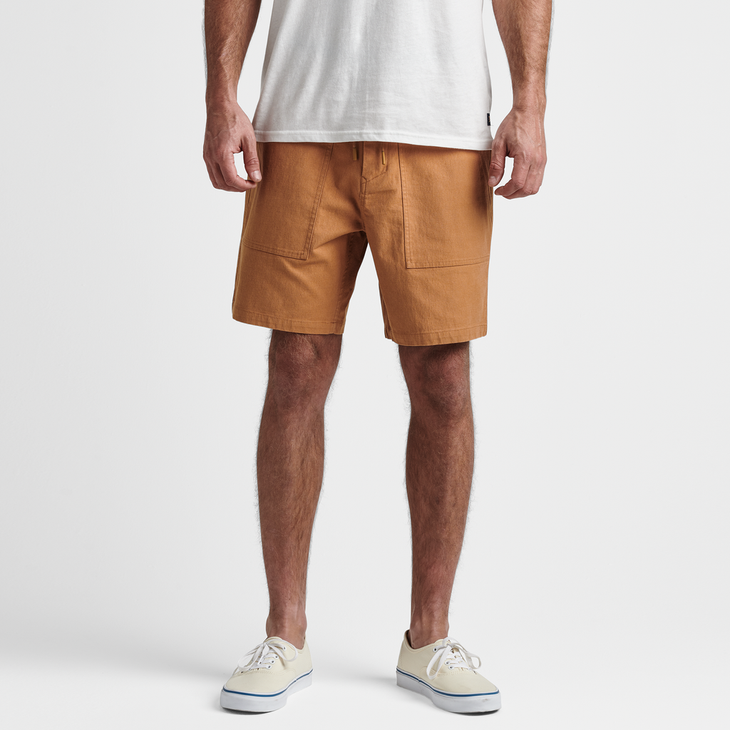 The model of Roark men's Layover Utility Shorts - Pignoli Big Image - 2